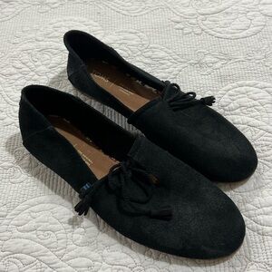 Tom’s black suede Kelly loafers